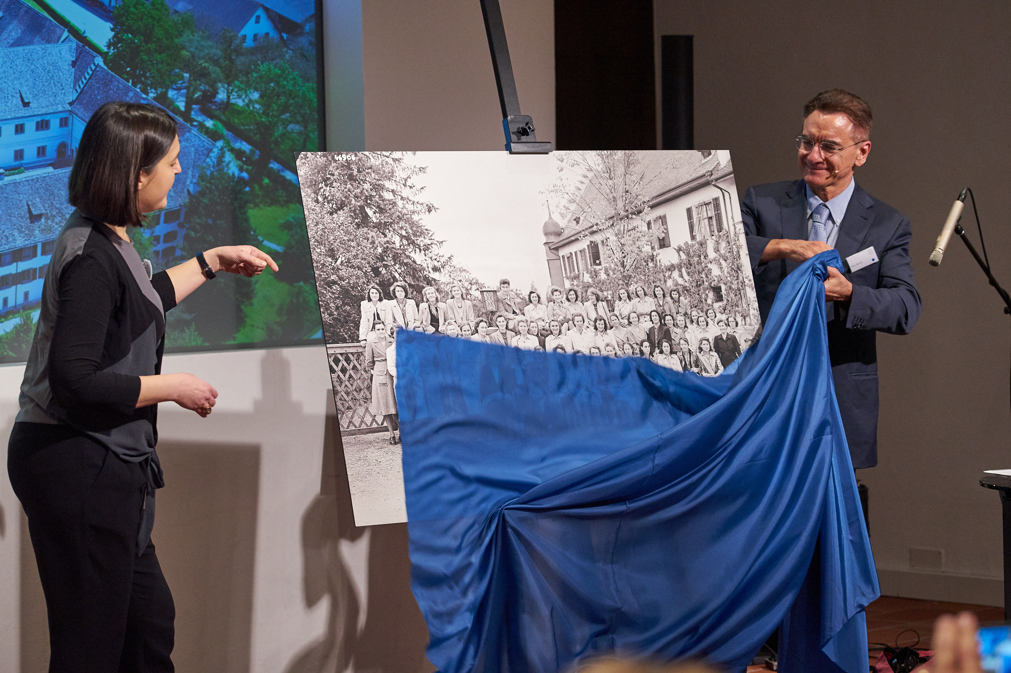 Franziska Eggimann, Head of Iron Library and Corporate Archivist, and Yves Serra opening a photography exhibition, which tells the history of GF at the Klostergut Paradies.